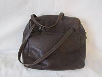 Brown textured leather shoulder bag with dual straps, soft structured shape.