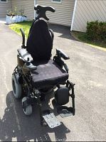 Front three-quarter view showing overall condition, seat, armrests and joystick control.