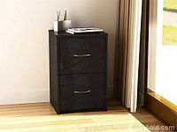 Photo of assembled 2 drawer filing cabinet in black with metal handles.