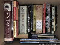 Photo of book lot showing about 14 books with titles on wine, cooking, gardening, and guides.