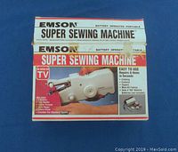 Emson Super Sewing Machine box labeled battery operated portable sewing machine with product image and features.