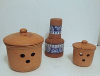 Full set of three barro kitchen items: water bottle, garlic bowl, onion bowl shown from front.