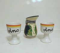 Front view of 2 Vino cups and handmade Talavera jug on white background