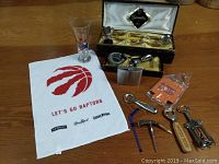 Glo Hill Barmate bar set with six pieces in original box, Raptors towel, glass, flash, drink cozy, and openers.