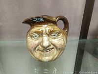 Front view of the Royal Doulton Toby jug with detailed human face and painted features.