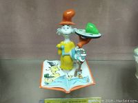 Front view of the Dr Seuss Sam and Ham figurine on an open storybook base showing bright colors and distinctive character design.