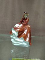 Front view of Royal Doulton Emma figurine showing detailed face and dress.