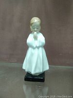 Front view of Royal Doulton porcelain figurine HN1978, girl in white nightgown praying, about 6 inches tall.