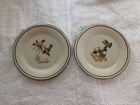 Photo showing a pair of two Lenox ceramic plates, cream colored with bird illustrations and rim accents.