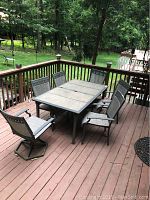 Overview of outdoor patio table and six chairs on deck