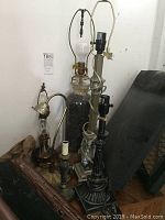 Overview of all six lamps grouped together showing varying heights and designs