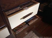 Two open drawers filled with DVD cases, showing the quantity and packaging style.
