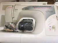 Singer Model 2662 sewing machine in original packing with foot pedal and accessories