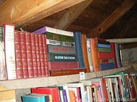 Two shelved rows showing multiple Folio Society slipcased editions in various colors