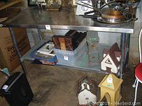Overall front view showing table top, lower shelf and contents