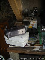 Overall lot on a table showing the Hamilton Beach hand mixer, kitchen pans, and stainless steel Marcato pasta maker.
