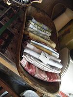 Wooden butter bowl with stacked folded tea towels inside, showing size and condition