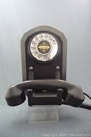 Front view of the telephone showing handset resting on cradle.