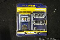 Front view of sealed Irwin impact bolt grip extractor set in original packaging showing layout of bits and accessories.