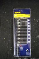 Front view of Irwin 8 piece impact deep well socket set in sealed plastic packaging with sizes 7/16" to 7/8" visible.