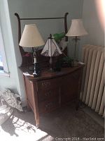 Side angle view of the wooden dressing table showing the mirror frame and side panel construction.
