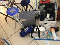 Full lot view showing Sport Seat, valet stands, cooler bag, backpack, umbrella, blankets and raincoats