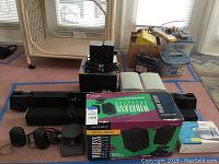 Overview of both sound bars, wireless subwoofer, satellite speakers, Optimus kit box and Emerson radio box