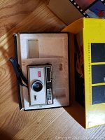 Kodak Instamatic 104 camera in original yellow box with foam insert