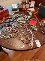 Wide shot of entire collection of costume jewelry on table