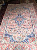 Full view of Karastan wool area rug showing central medallion and overall design.