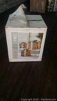 Box of set of 3 rattan glitter gift boxes with LED lights, showing original packaging with product photo on the front.