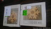 Two boxed 3D glitter snowflake decorations by Gluckstein Home, displayed side-by-side.