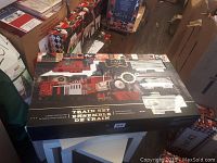 Photo of F.A.O Schwarz motorized train set box showing product image and key features