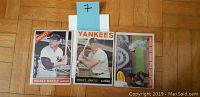 Fronts of three Mickey Mantle Topps cards showing card faces and condition.