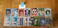 Photo showing 15 vintage baseball cards laid out in 3 rows, including Nolan Ryan, Ted Killebrew, Ted Williams, Brooks Robinson, Bo Jackson Rookie, and others.