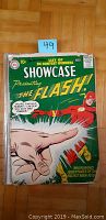 Front cover of Showcase #8 comic book showing Flash cover art, price box, DC logo and tape on spine