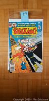 Front cover of Shazam! #28 comic book showing Shazam and Black Adam fighting, with comic book price and title visible.