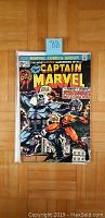 Front cover image of Captain Marvel #33 comic book featuring Thanos and Captain Marvel.