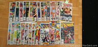 31 X-Men comic books arranged in two rows, showing front covers with various characters and issue numbers.