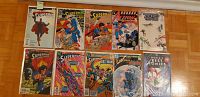 Top view of ten comic books featuring Superman and related characters with various colorful covers.