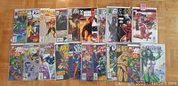 Photo of 22 Marvel comic books, all issue #1, arranged on floor surface showing covers for identification