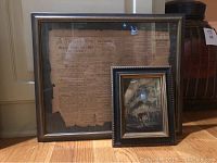 Framed newspaper and framed photo together showing size and condition.