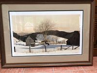 Full view of the custom framed print showing the snowy landscape, barns, and a tree under clear light conditions.