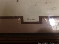 Framed art print titled 'Snowlight' with visible signature and numbering by Carol Lackey Bates.