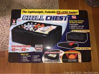 Photo of the unopened boxed Chill Chest cooler showcasing features such as foldability, ice-less use, and capacity.