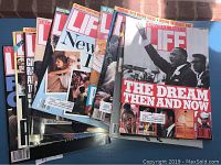 Photo showing a collection of nine LIFE magazines from the 1980s with varied cover images and titles, including a special edition on Martin Luther King Jr.