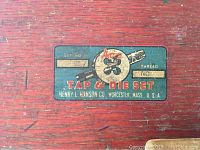 Close-up of red wooden box label reading Ace Tap & Die Set by Henry L. Hanson Co.