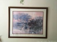 Framed watercolour print of a misty nature scene with trees and water, in soft pastel colors in a classic wood frame.