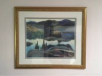 Front view of one framed landscape print with carved gold frame and glass, depicting stylized hills and water scene.