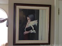 Full front view of the framed print hanging on a wall near a window.